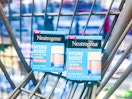 Neutrogena Hydro Boost Lip Balm boxes in a Walmart cart