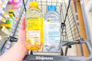hand holding two bottles of garnier micellar water
