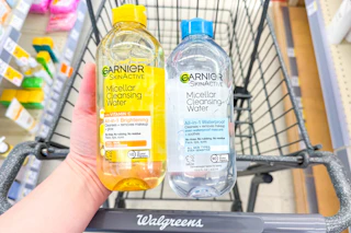 hand holding two bottles of garnier micellar water