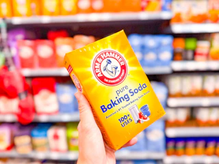2-pound box of Baking Soda held up in Walmart store