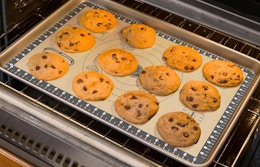 cookies on a baking mat in an oven