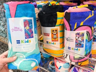 disney beach towels on shelf