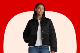 Stock image of a woman wearing a black Time and Tru puffer jacket