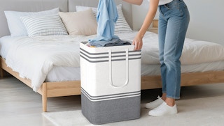 a person pulling laundry out of a basket