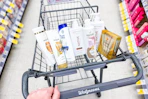 hand pushing a walgreens cart with pantene, head & shoulders, native sponsored