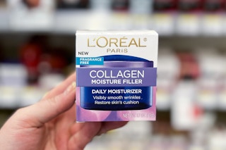 hand holding a box of L'Oreal collagen cream