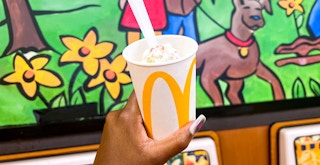 hand holding the mcdonalds limited-time strawberry shortcake mcflurry in restaurant