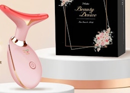 a pink face and neck massager on a display