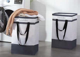 two laundry baskets in a laundry room with clothes inside