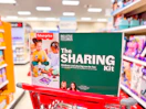 fisher price big little feelings sharing kit sitting on top a target cart