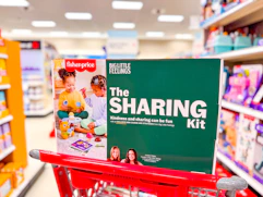 fisher price big little feelings sharing kit sitting on top a target cart
