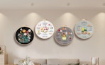 4 embroidery rings on a wall  