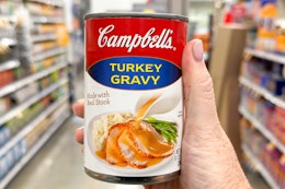 hand holding a can of campbells gravy