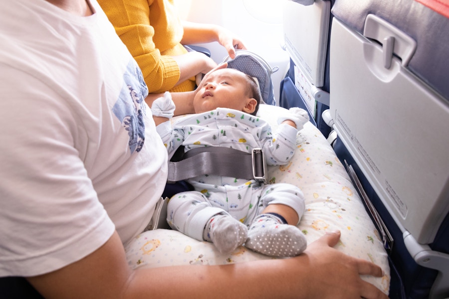 Baby on lap on airplane