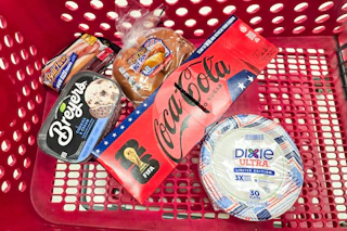 ball park buns and hot dogs, breyers ice cream, coca-cola, and dixie paper plates in a cart