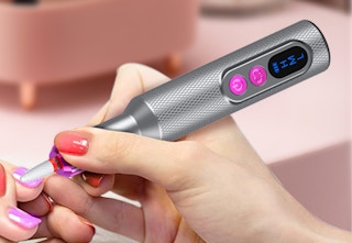 nail drill working on hand