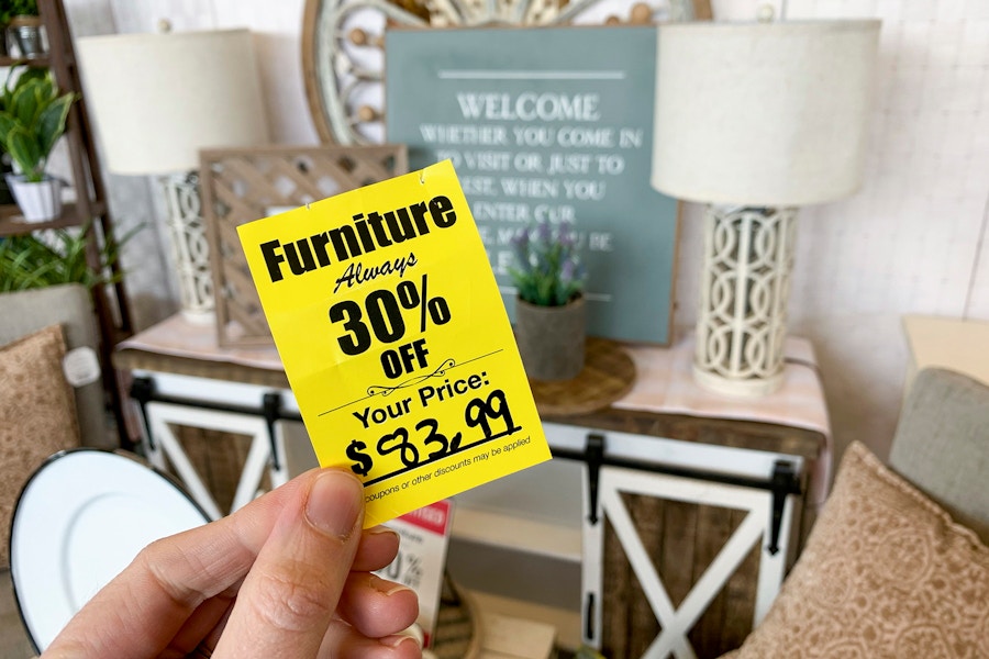 A yellow furniture tag that reads "furniture alway 30% off".