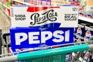 pepsi soda 12-packs stacked on shopping cart