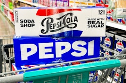 pepsi soda 12-packs stacked on shopping cart