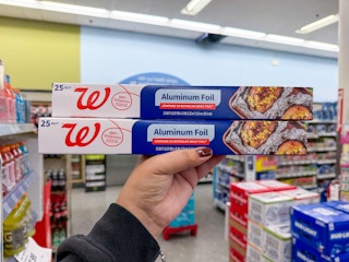hand holding walgreens aluminum foil packs