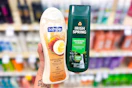 person holding softsoap and irish spring body wash in front of a shelf