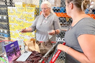 costco employee checking out cart at door