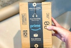 an amazon box being held