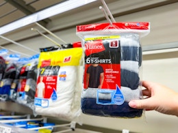 hand grabbing a hanes mens shirt pack off a target shelf