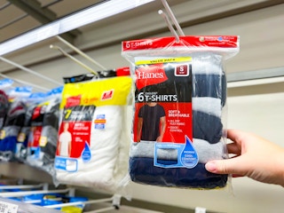 hand grabbing a hanes mens shirt pack off a target shelf