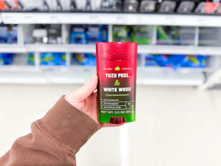 hand holding old spice alchemist deodorant in walgreens