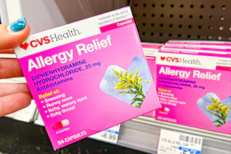 hand holding cvs health allergy relief medicine