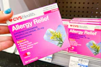 hand holding cvs health allergy relief medicine