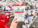 hand holding a 5-pack of hanes toddler tees in target apparel