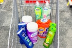 nivea body wash, lysol wipes, garnier shampoo, tide pods, and softsoap hand soap in a cart