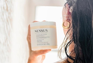 a person holding a jar