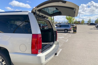 A vehicle with an open trunk waiting for a grocery pickup order.