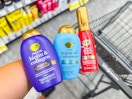 person holding OGX hair care