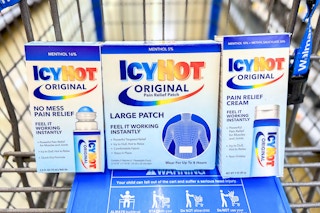 three icy hot products displayed in a Walmart shopping cart