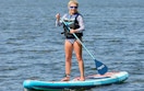 a person on a paddle board in the water