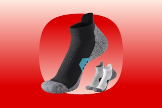A large black men's ankle sock and two smaller ones in grey and white. They have heathered bottoms and elastic around the arches.