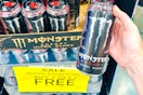 hand holding a monster energy drink