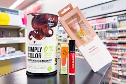 hair color, lip gloss, makeup brush on a shelf