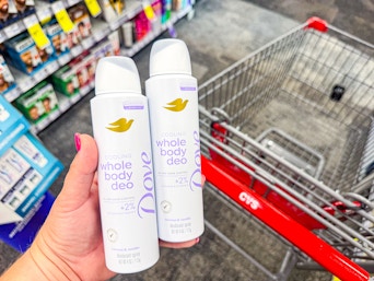 hand holding dove whole body deodorant sprays