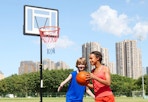 children playing basketball with the basketball hoop