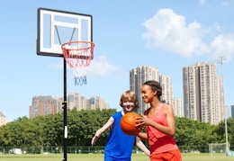 children playing basketball with the basketball hoop