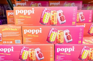 poppi soda cases stacked