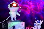 an astronaut galaxy projector on a box