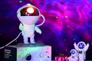 an astronaut galaxy projector on a box