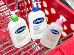 3 cetaphil skin care items sitting in a target cart