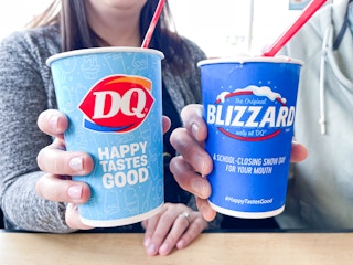 two people holding dairy queen summer blizzards 